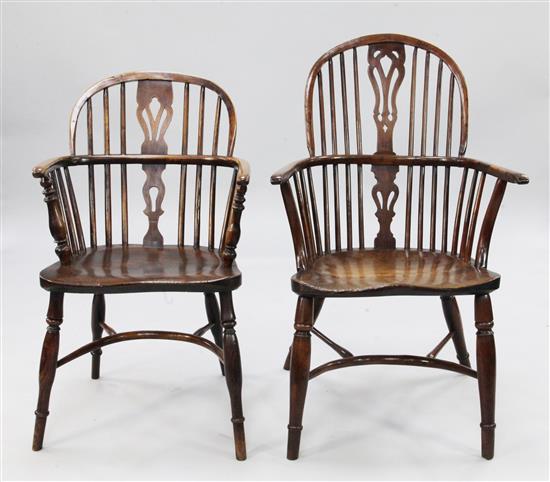 A harlequin set of thirteen early 19th century yew, elm and ash Windsor elbow chairs,